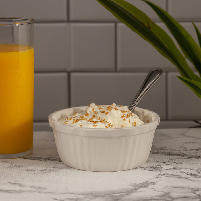 Organic Golden Flax Seeds in a bowl of yogurt